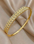 Gold-Plated Leaf Design Crystal Bangle Bracelet – Elegant Hinged Cuff for Women.