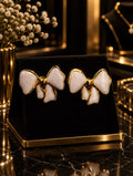 White Enamel Bow Gold Stud Earrings.
